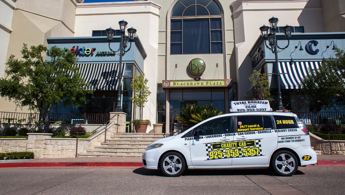 Charity Cab service parked in front of Blackhawk Plaza