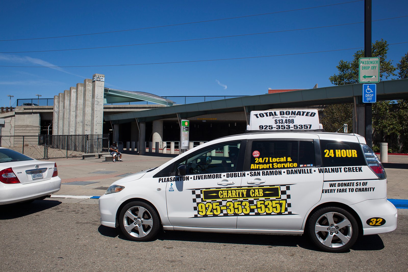 taxi picking up a passenger at dublin bart station